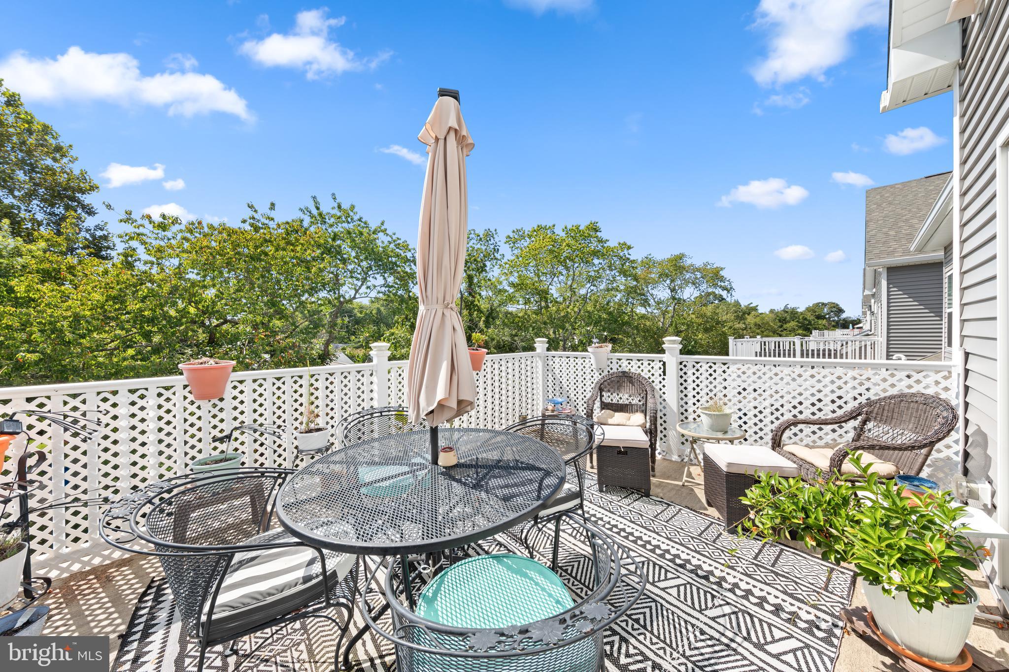 24525 Merlot Drive Lewes, DE 19958 - Photo 39 of 40 a view of a patio with a table chairs and a table