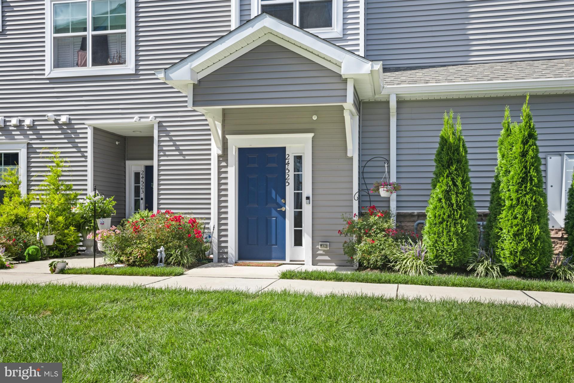 24525 Merlot Drive Lewes, DE 19958 - Photo 4 of 40 a front view of a house with garden