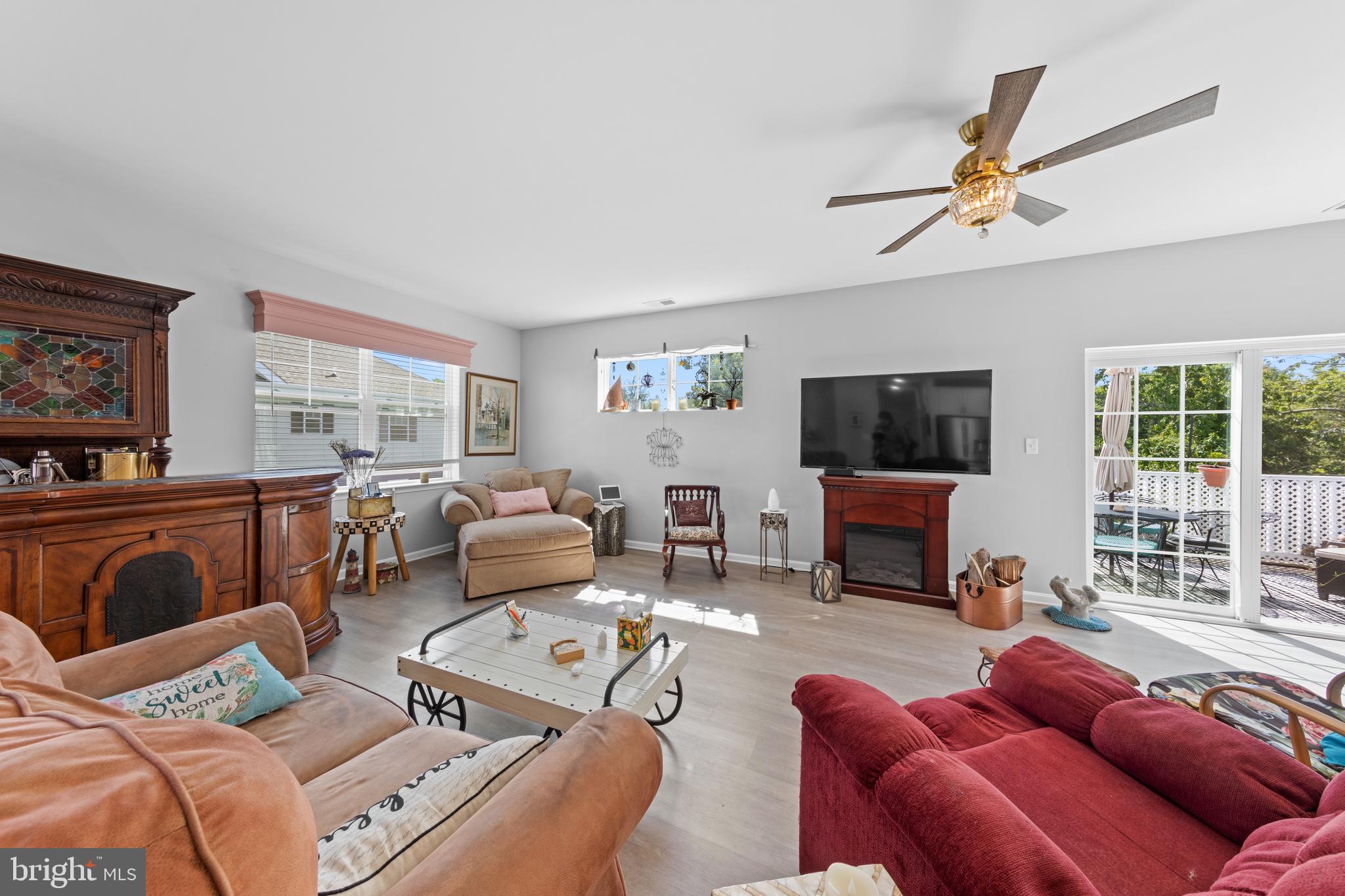 24525 Merlot Drive Lewes, DE 19958 - Photo 7 of 40 a living room with furniture ceiling fan and a window