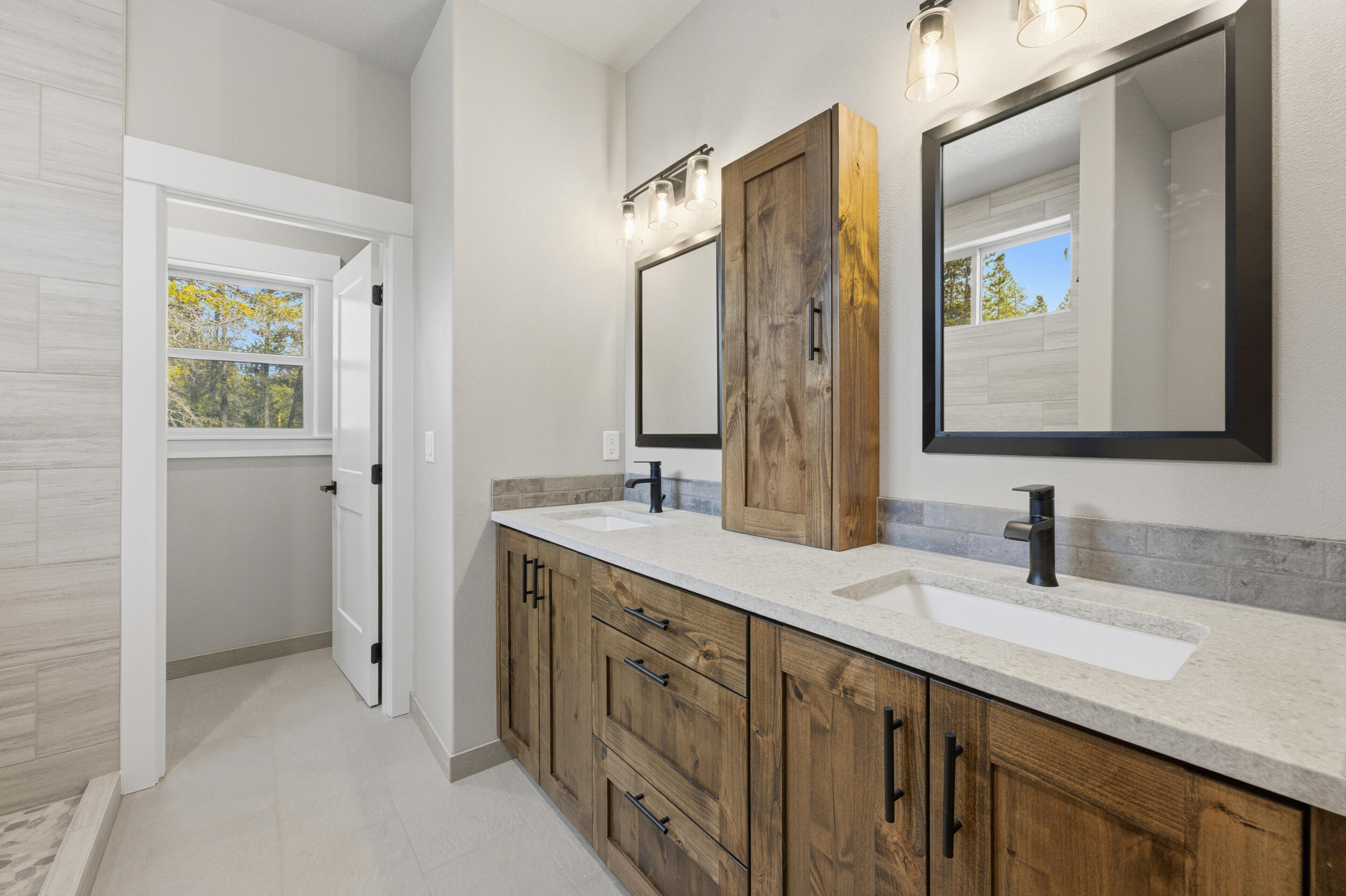 16083 Dyke Road, Unit 9 La Pine, OR 97739 - Photo 23 of 53 a bathroom with a double vanity sink and a mirror