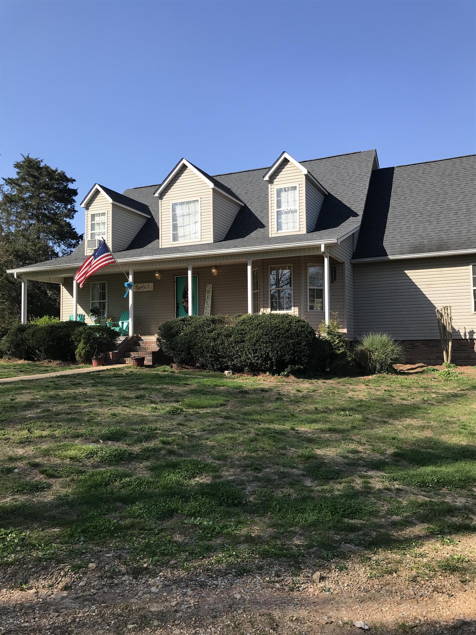 82 Five Points Road Loretto, TN 38469 - Photo 1 of 24 a front view of a house with a garden