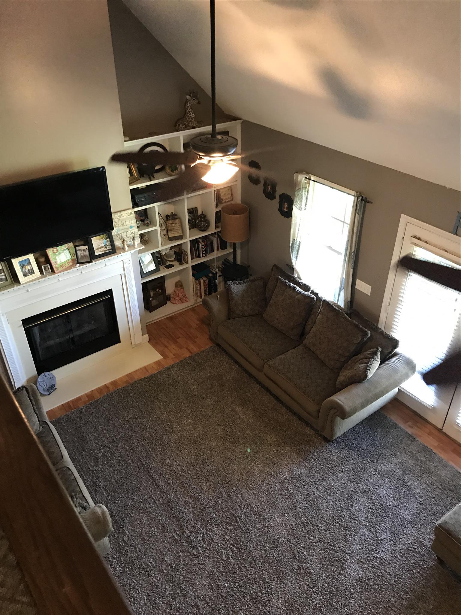 82 Five Points Road Loretto, TN 38469 - Photo 16 of 24 a living room with furniture a flat screen tv