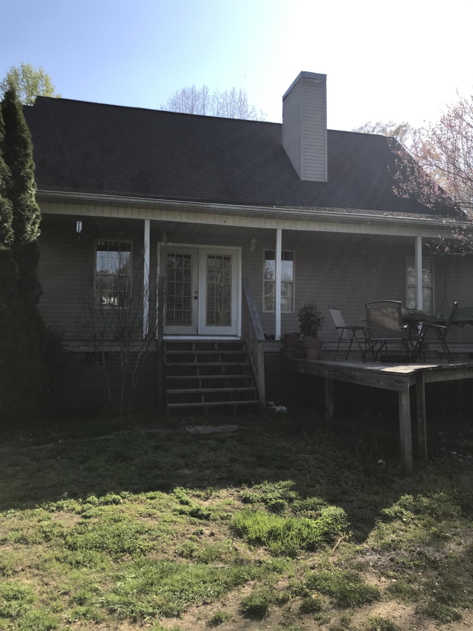 82 Five Points Road Loretto, TN 38469 - Photo 20 of 24 a front view of a house with a yard