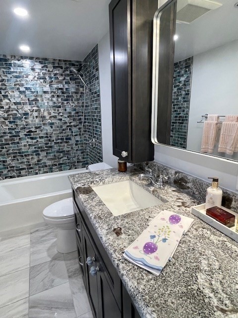 1731 Beacon Street, Unit 512 Brookline, MA 02445 - Photo 15 of 41 a bathroom with a granite countertop sink and a mirror