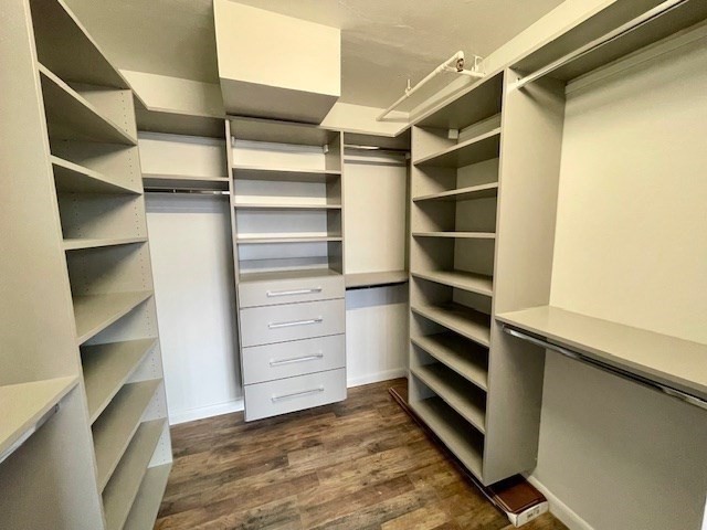 1731 Beacon Street, Unit 512 Brookline, MA 02445 - Photo 22 of 41 a view of walk in closet with empty racks