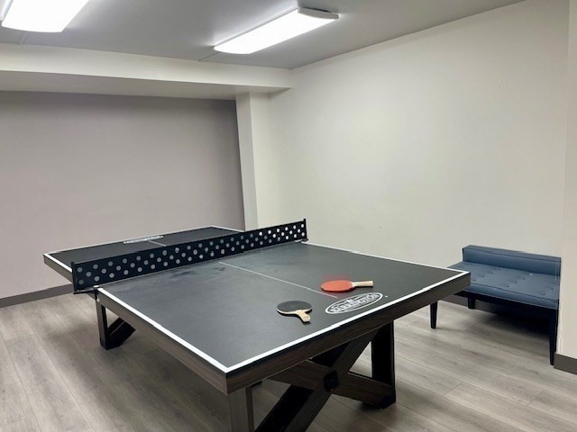 1731 Beacon Street, Unit 512 Brookline, MA 02445 - Photo 25 of 41 a room with furniture pool table and wooden floor