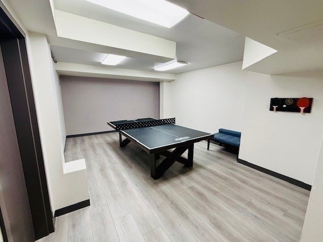 1731 Beacon Street, Unit 512 Brookline, MA 02445 - Photo 26 of 41 a living room with furniture and a wooden floor