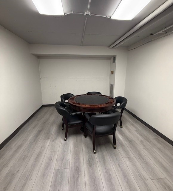 1731 Beacon Street, Unit 512 Brookline, MA 02445 - Photo 28 of 41 a small space that has a couch and a wooden floor