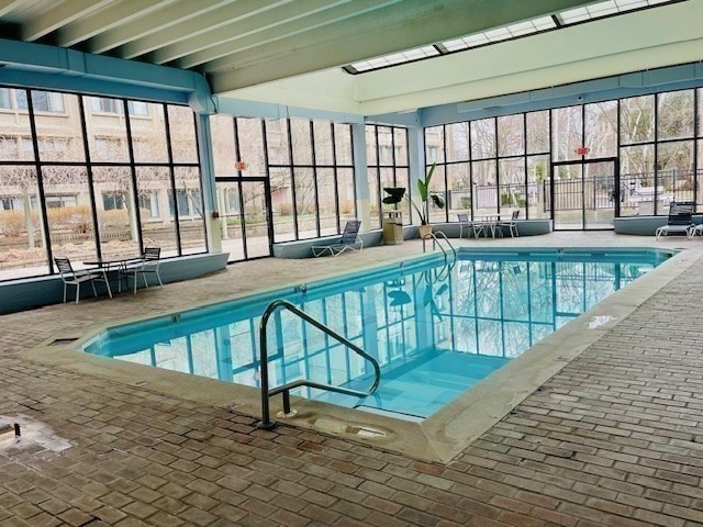 1731 Beacon Street, Unit 512 Brookline, MA 02445 - Photo 32 of 41 a view of swimming pool with seating area
