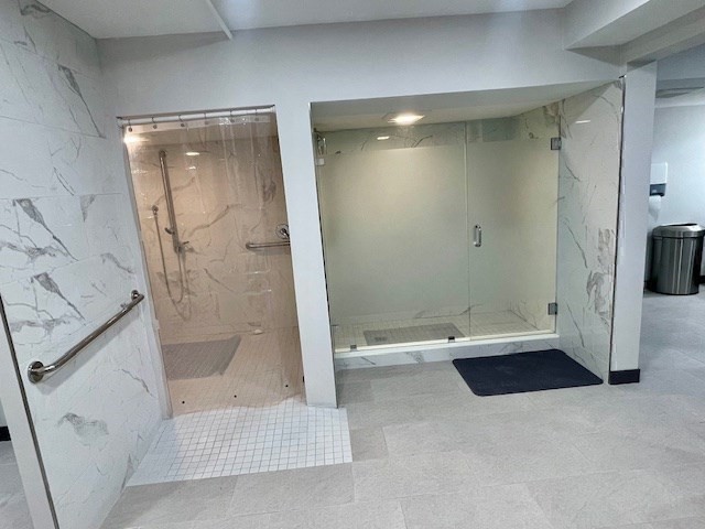 1731 Beacon Street, Unit 512 Brookline, MA 02445 - Photo 37 of 41 a bathroom with a tub and a shower