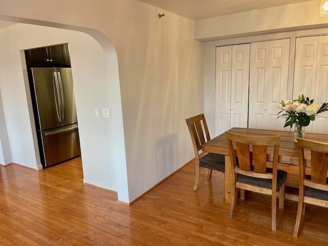 1731 Beacon Street, Unit 512 Brookline, MA 02445 - Photo 9 of 41 a dining room with furniture and wooden floor