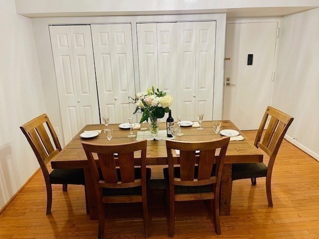 1731 Beacon Street, Unit 512 Brookline, MA 02445 - Photo 10 of 41 a view of a dining room with furniture and wooden floor