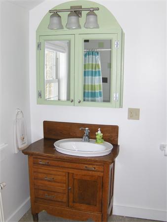 84 Warwick Road Northfield, MA 01360 - Photo 17 of 30 a bathroom with a sink and a mirror