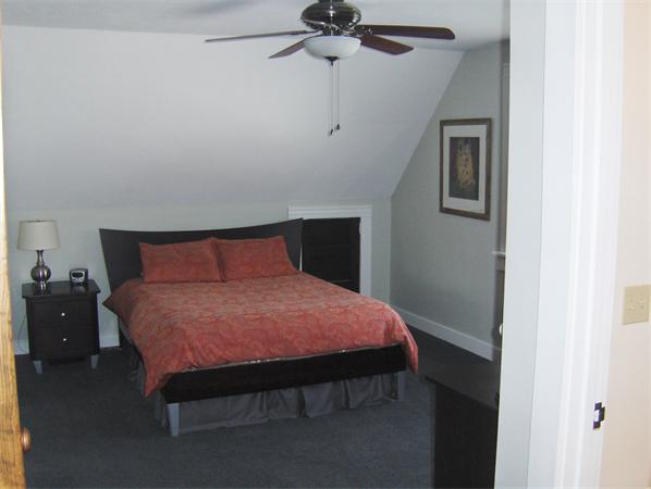 84 Warwick Road Northfield, MA 01360 - Photo 21 of 30 a bedroom with a bed and a chandelier