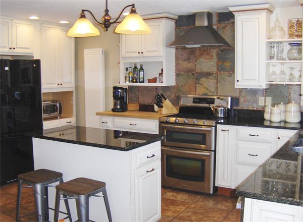 84 Warwick Road Northfield, MA 01360 - Photo 10 of 30 a kitchen with stainless steel appliances a sink stove and cabinets