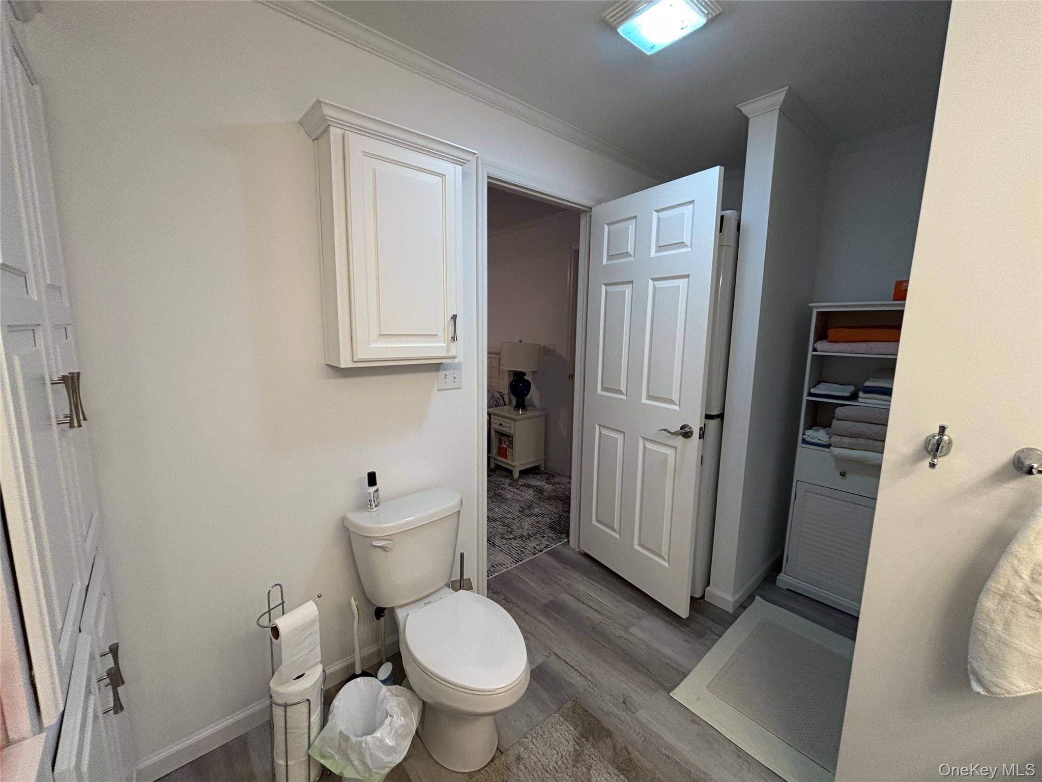 61 Forge Road, Unit 29 Riverhead, NY 11901 - Photo 16 of 38 a bathroom with a toilet and a shower