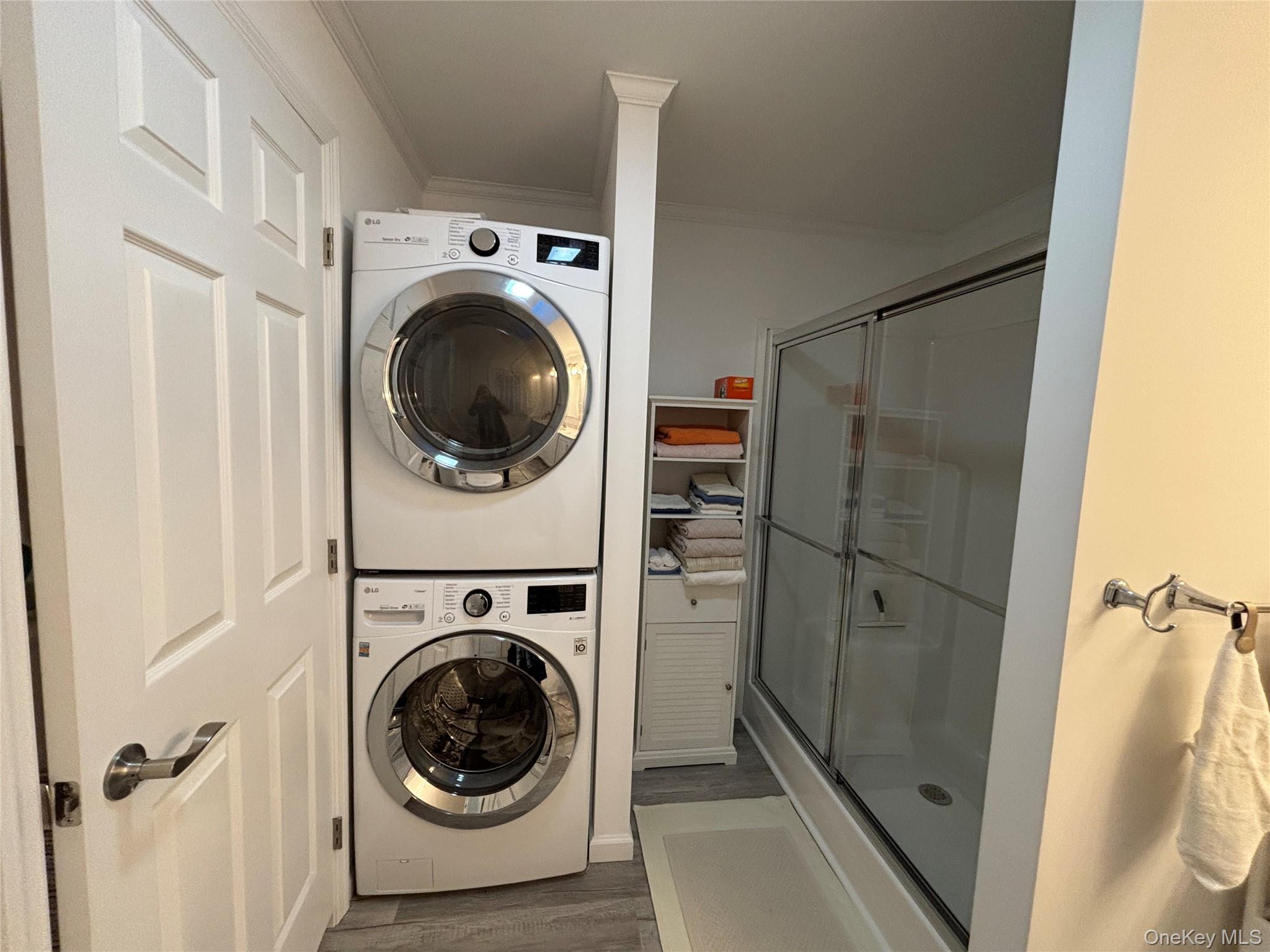61 Forge Road, Unit 29 Riverhead, NY 11901 - Photo 17 of 38 a utility room with dryer and washer
