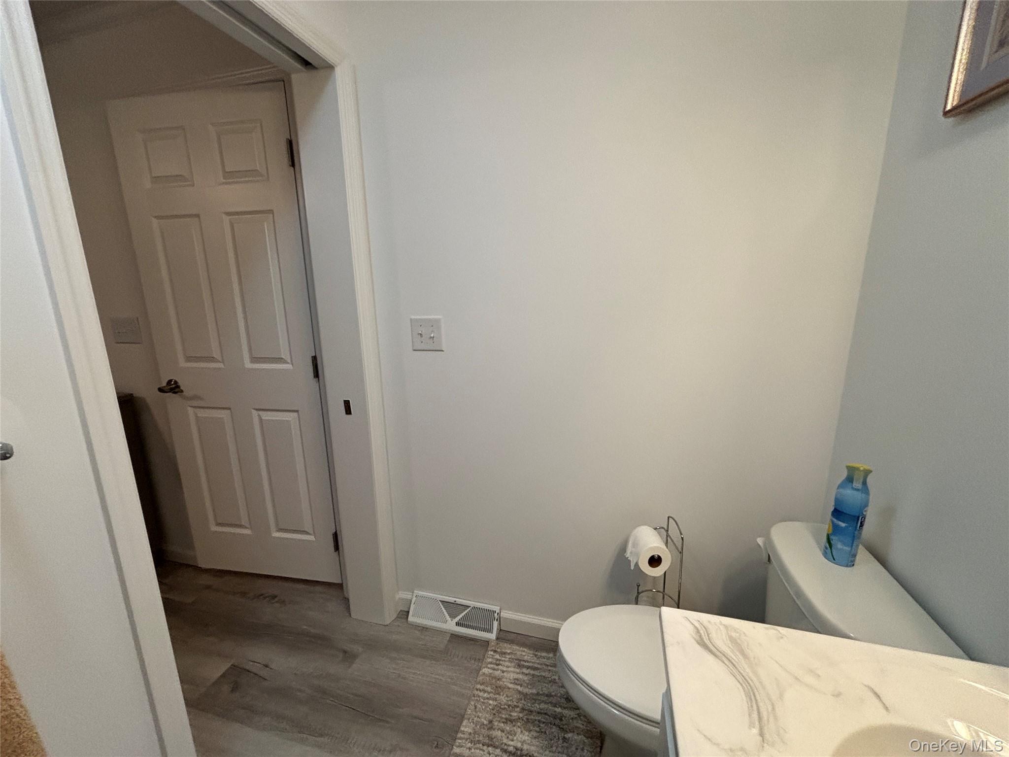 61 Forge Road, Unit 29 Riverhead, NY 11901 - Photo 24 of 38 a bathroom with a sink and toilet