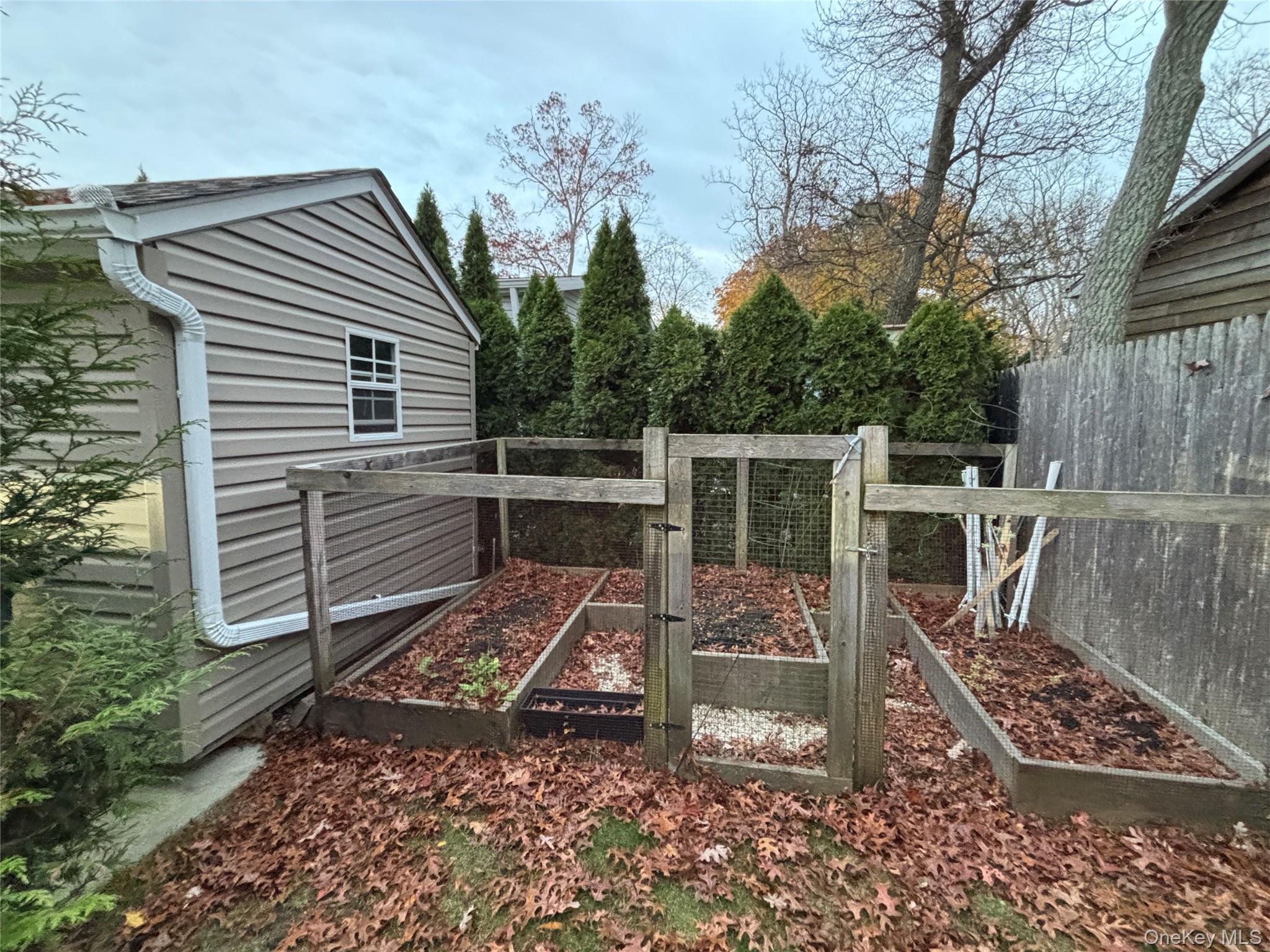 61 Forge Road, Unit 29 Riverhead, NY 11901 - Photo 31 of 38 a view of house with a chairs in patio