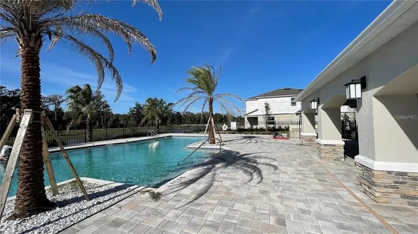 a view of a swimming pool with a patio