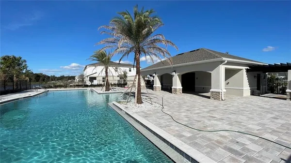 a view of a house with swimming pool