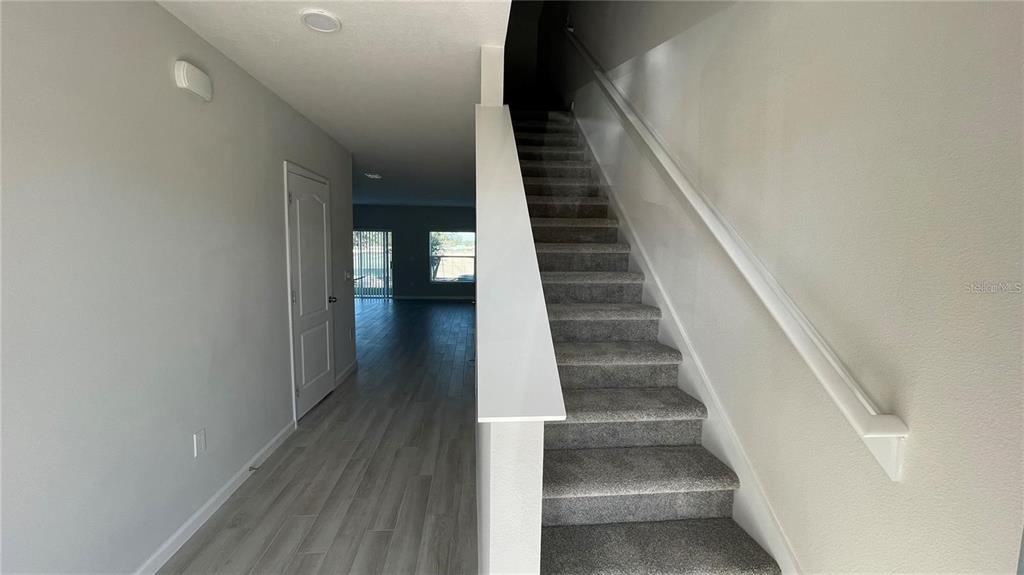 5175 Tyson Ranch Boulevard Orlando, FL 32824 - Photo 6 of 21 a view of entryway and hall with wooden floor