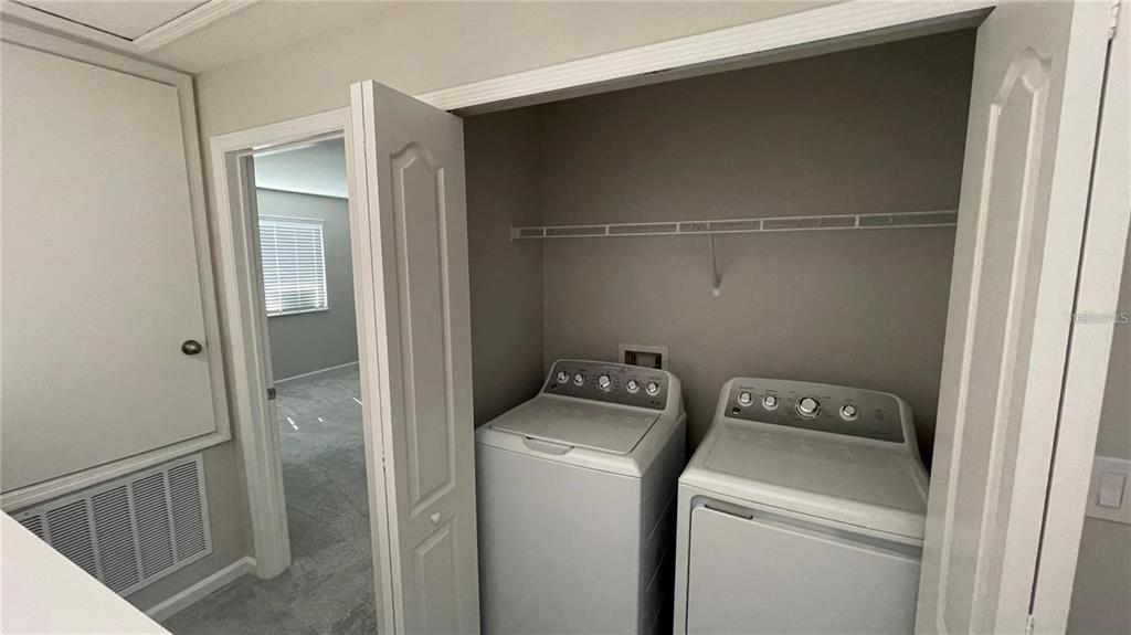 5175 Tyson Ranch Boulevard Orlando, FL 32824 - Photo 8 of 21 a utility room with dryer and washer