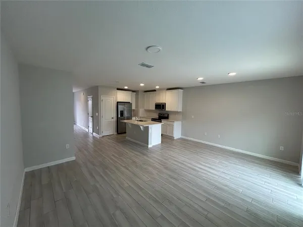 a view of kitchen with wooden floor