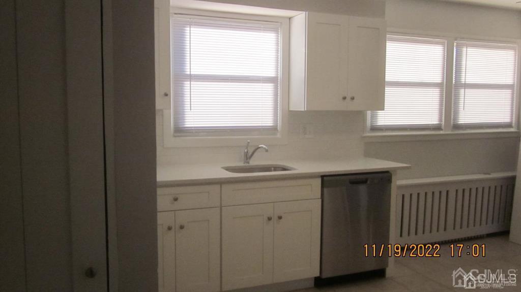 B Plainfield Road Edison, NJ 08820 - Photo 4 of 7 a kitchen with a sink window and cabinets