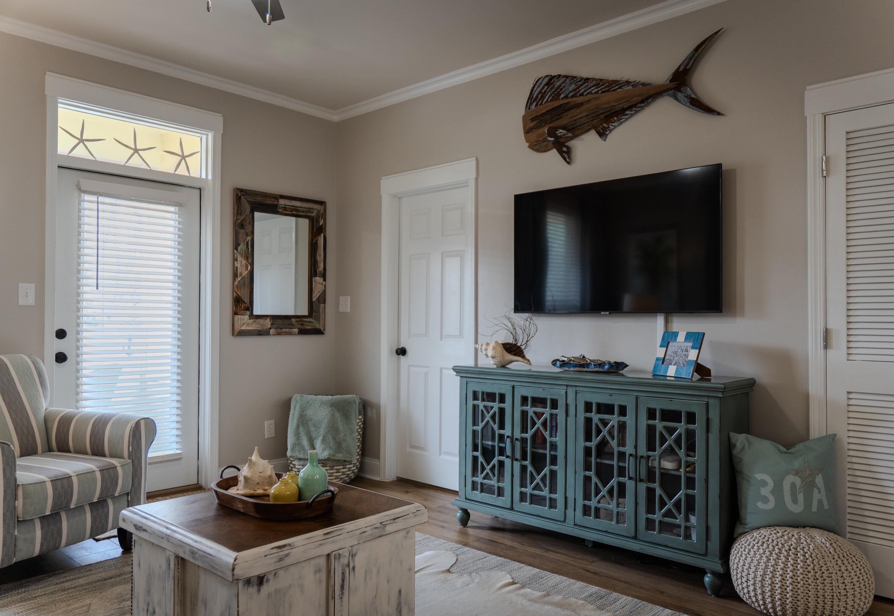 136 Shorebird Drive, Unit 724 Santa Rosa Beach, FL 32459 - Photo 11 of 49 a living room with furniture and a flat screen tv