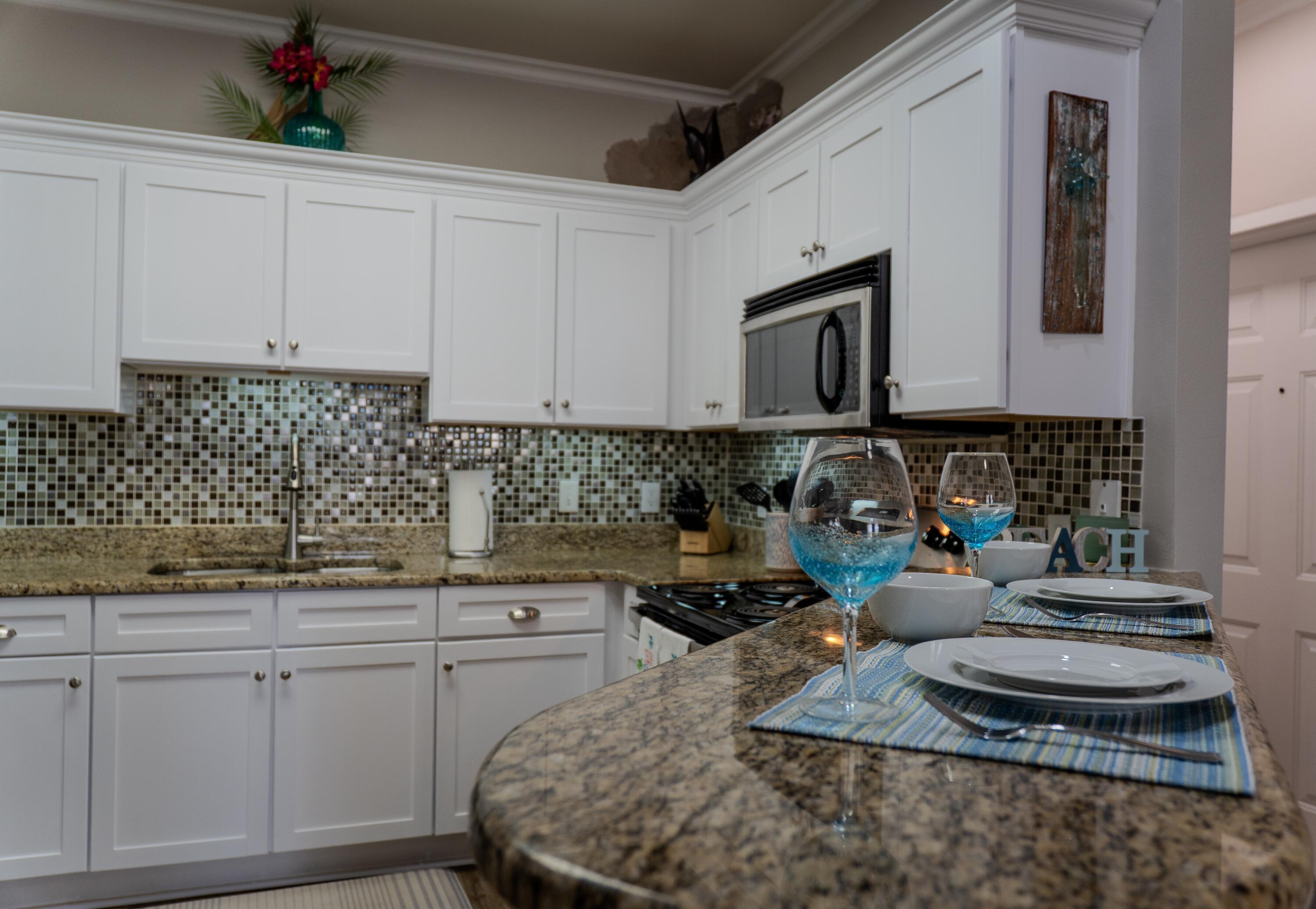136 Shorebird Drive, Unit 724 Santa Rosa Beach, FL 32459 - Photo 13 of 49 a kitchen with sink cabinets and window