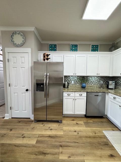 136 Shorebird Drive, Unit 724 Santa Rosa Beach, FL 32459 - Photo 14 of 49 a kitchen with stainless steel appliances granite countertop a refrigerator and a stove