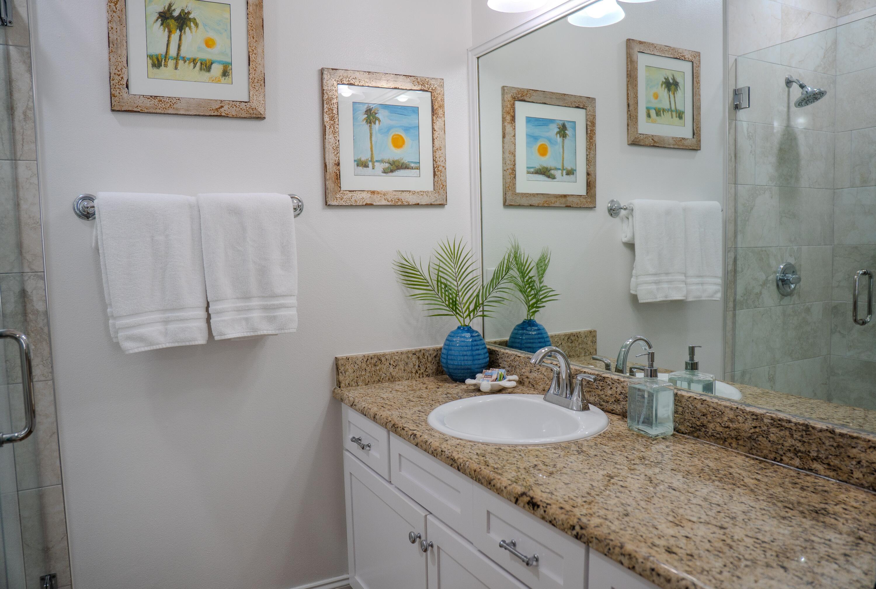 136 Shorebird Drive, Unit 724 Santa Rosa Beach, FL 32459 - Photo 23 of 49 a bathroom with a granite countertop sink and a mirror
