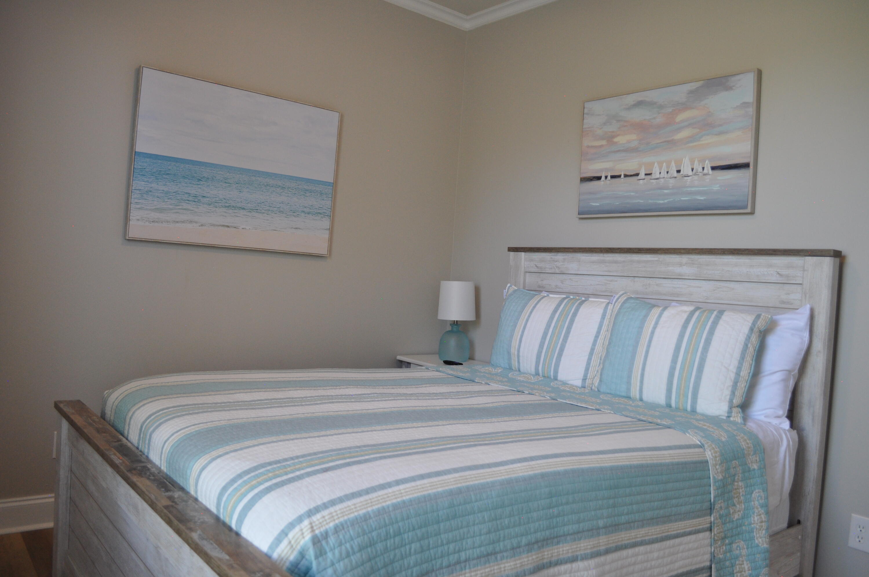 136 Shorebird Drive, Unit 724 Santa Rosa Beach, FL 32459 - Photo 25 of 49 a bedroom with a bed and painting on the wall