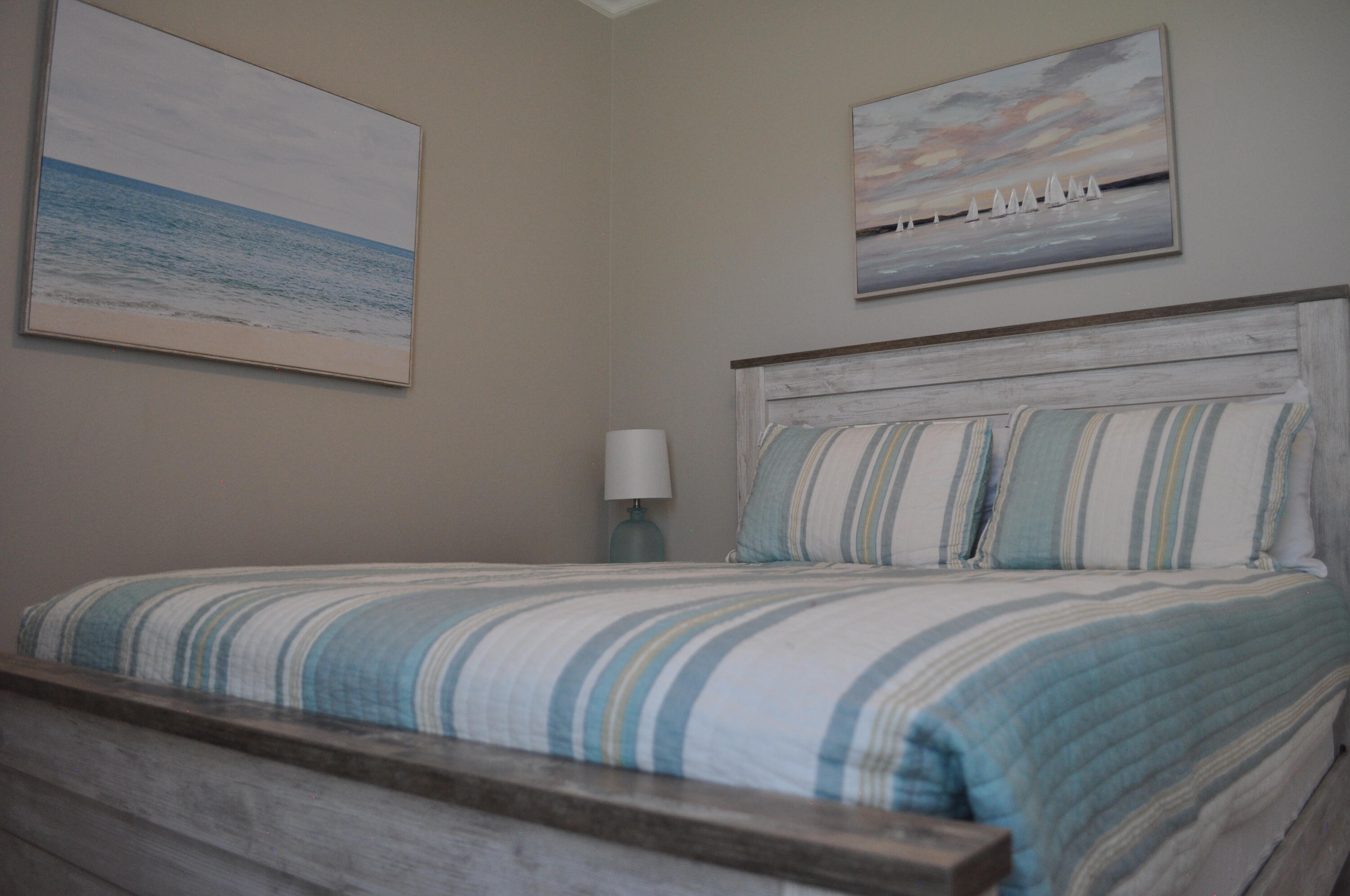 136 Shorebird Drive, Unit 724 Santa Rosa Beach, FL 32459 - Photo 27 of 49 a bedroom with a bed and painting on the wall