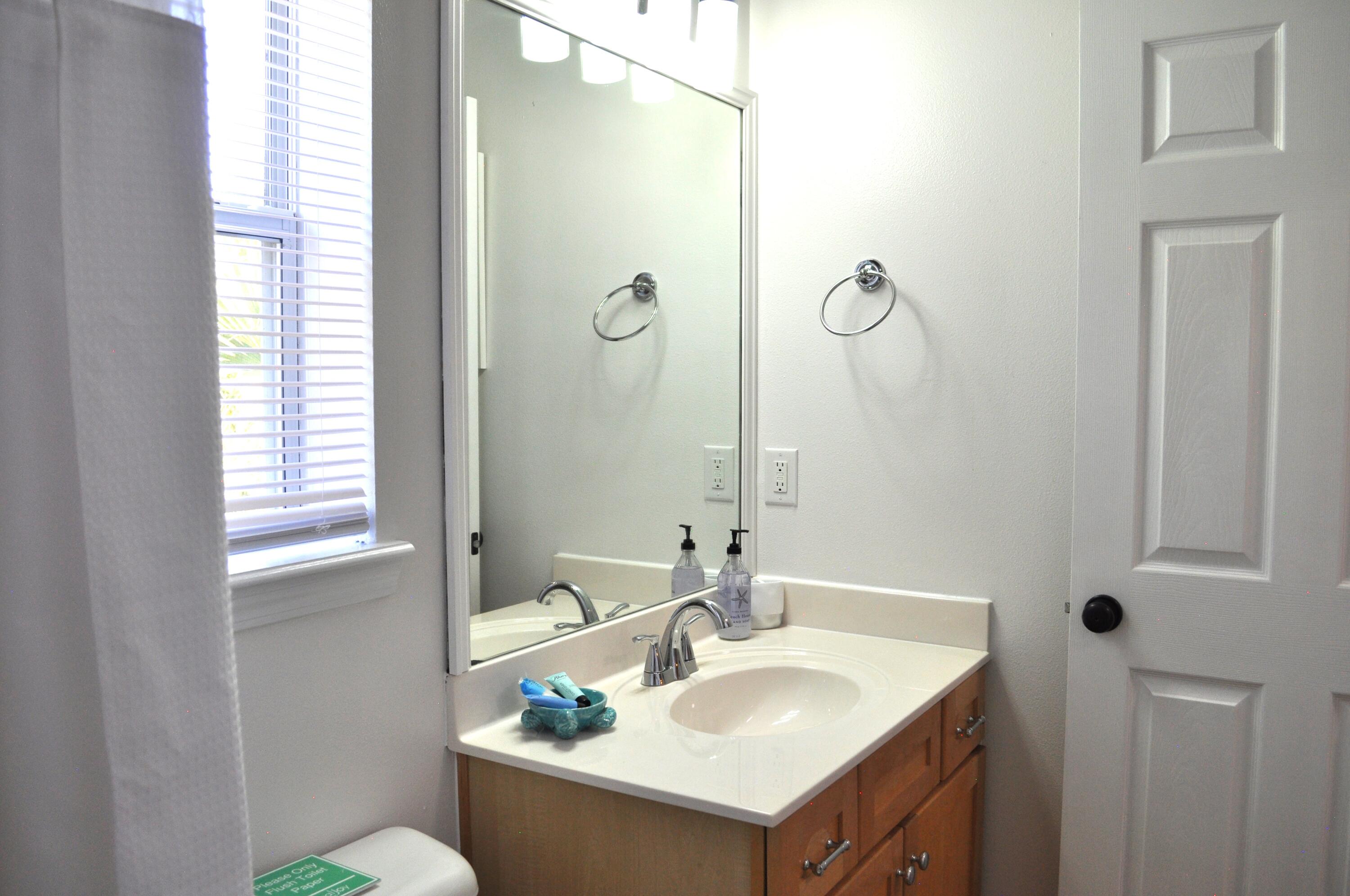 136 Shorebird Drive, Unit 724 Santa Rosa Beach, FL 32459 - Photo 29 of 49 a bathroom with a sink and a mirror