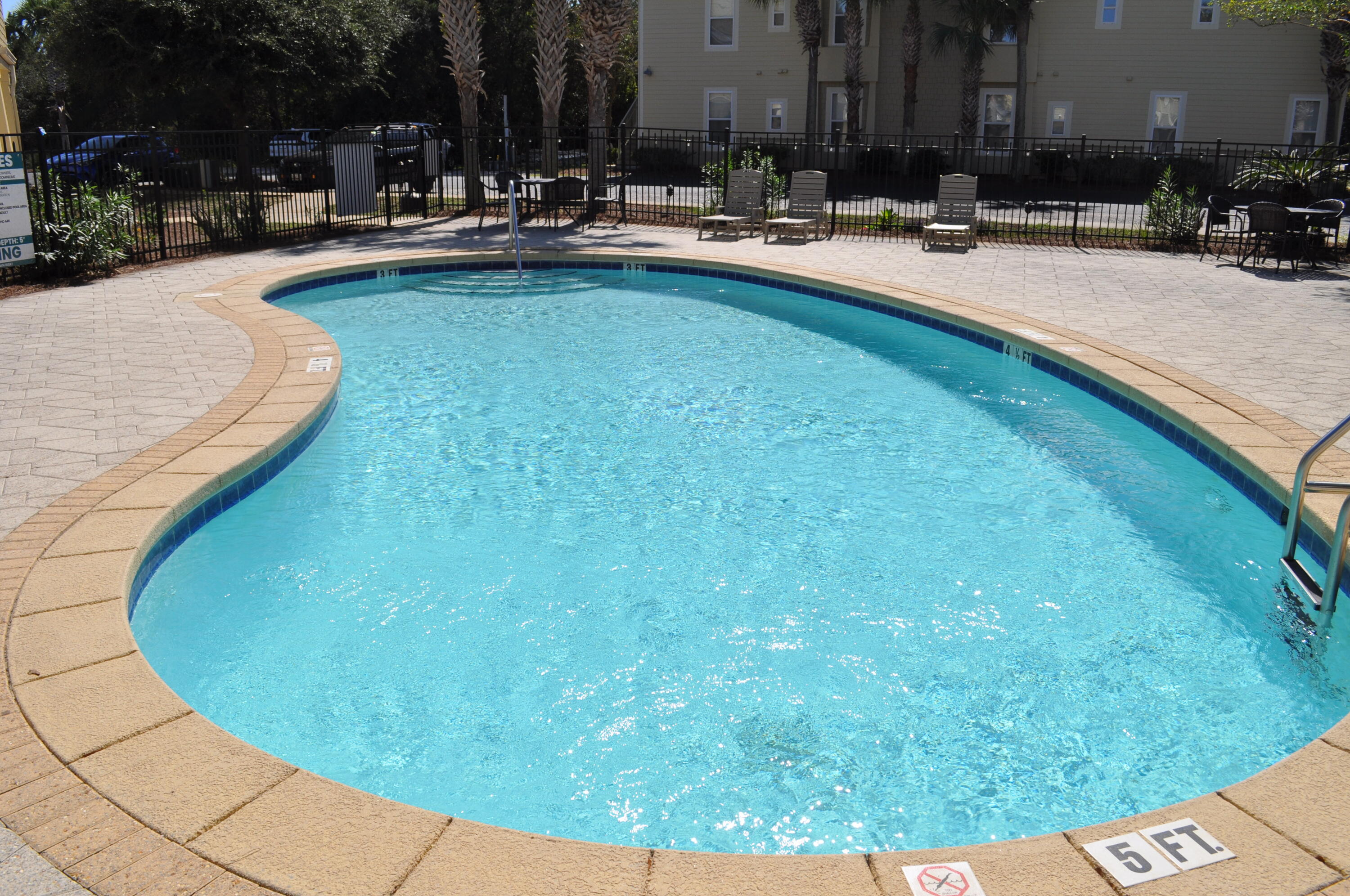 136 Shorebird Drive, Unit 724 Santa Rosa Beach, FL 32459 - Photo 40 of 49 a swimming pool with outdoor seating and yard