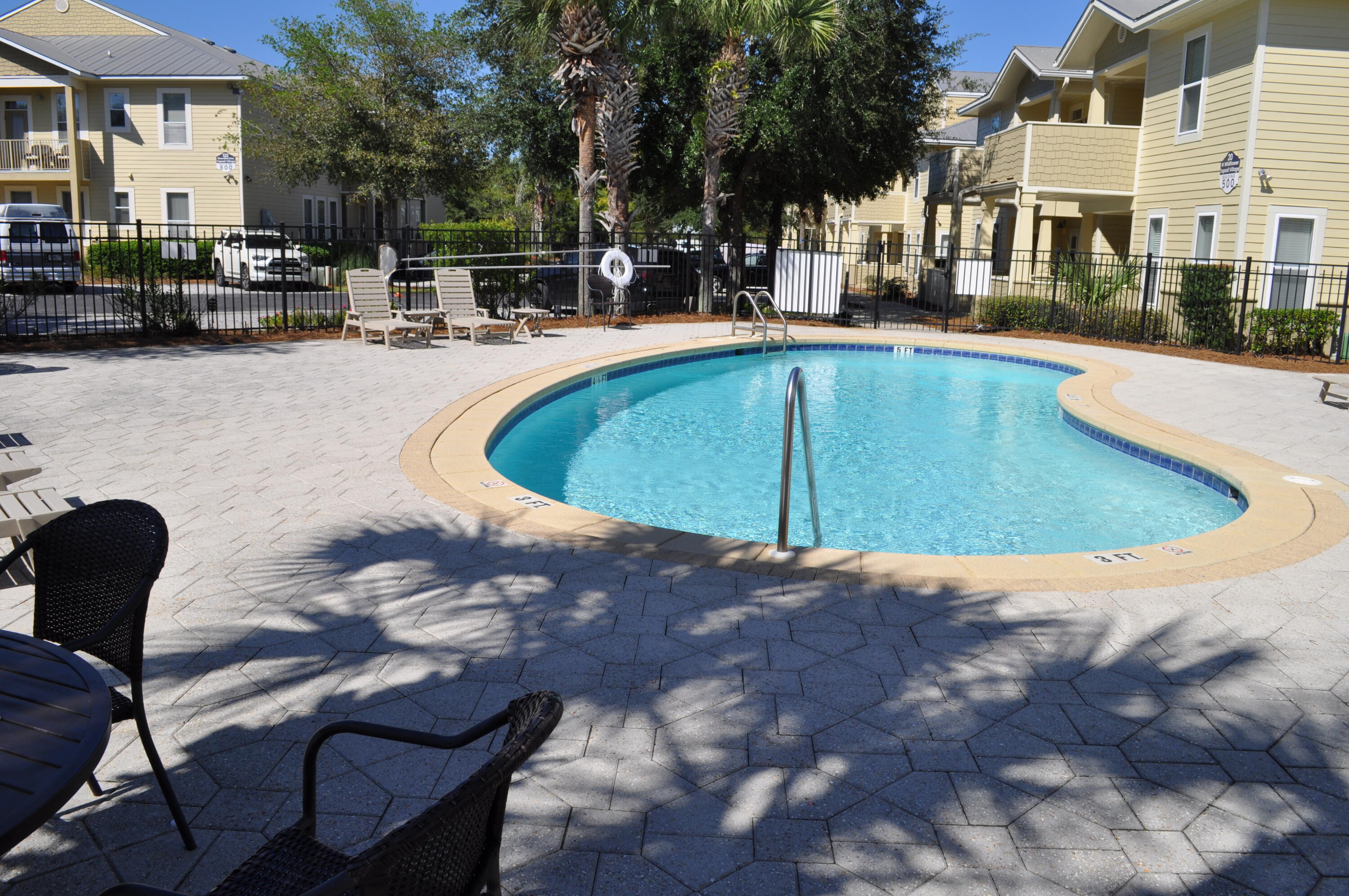 136 Shorebird Drive, Unit 724 Santa Rosa Beach, FL 32459 - Photo 41 of 49 a view of a swimming pool with chairs