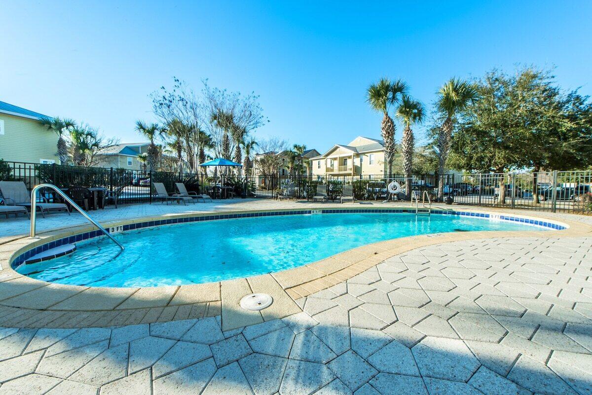 136 Shorebird Drive, Unit 724 Santa Rosa Beach, FL 32459 - Photo 42 of 49 a view of a house with swimming pool and a yard