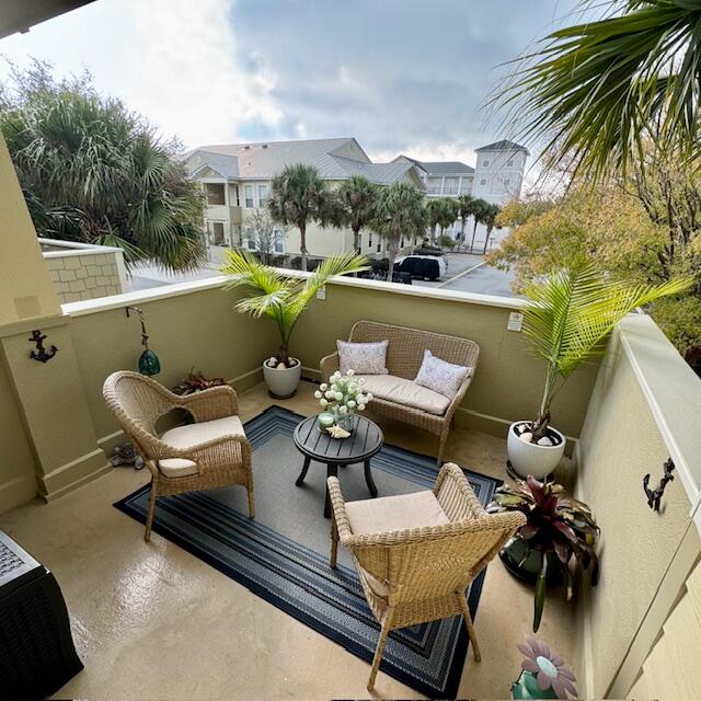 136 Shorebird Drive, Unit 724 Santa Rosa Beach, FL 32459 - Photo 5 of 49 a roof deck with couple of chairs and a fire pit