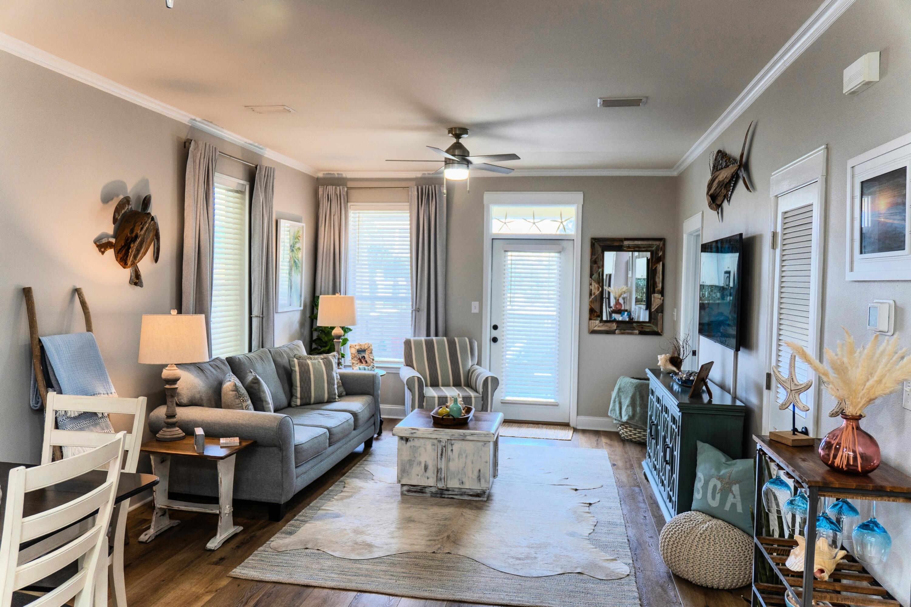 136 Shorebird Drive, Unit 724 Santa Rosa Beach, FL 32459 - Photo 6 of 49 a living room with furniture and wooden floor
