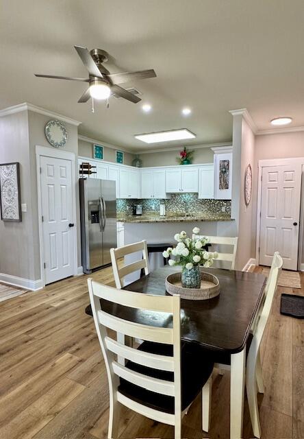 136 Shorebird Drive, Unit 724 Santa Rosa Beach, FL 32459 - Photo 8 of 49 a view of a dining room with furniture and wooden floor