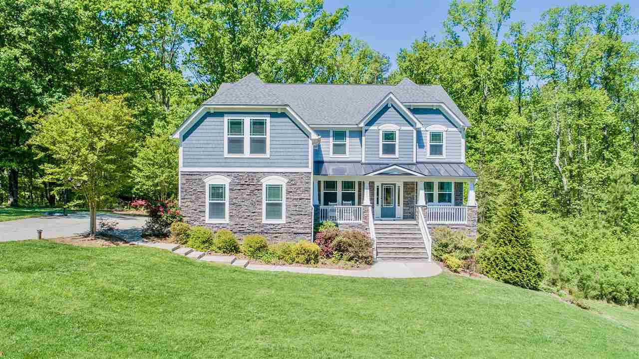 1309 Kintail Drive Raleigh, NC 27613 - Photo 1 of 30 Breathtaking custom craftsman-style home with stone facade on unique 1.8 acres of expansive woods/open space. Tall sealed climate controlled crawl space with 12 foot ceilings - plenty of storage space!! Exterior Front