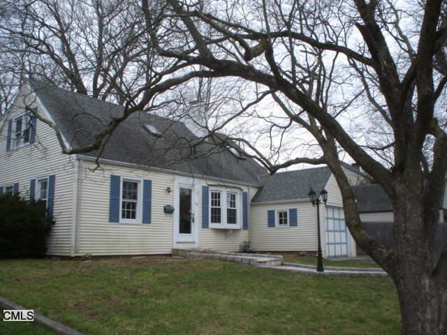 42 Riverside Avenue Stamford, CT 06905 - Photo 1 of 1 a front view of a house with a yard