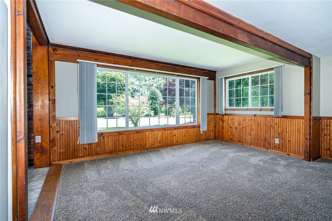 1561 King Road Winlock, WA 98596 - Photo 11 of 23 an empty room with large windows and a bed