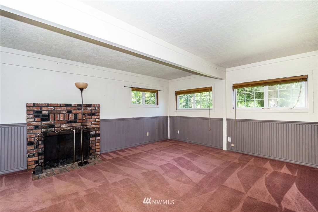 1561 King Road Winlock, WA 98596 - Photo 20 of 23 a view of a livingroom with a fireplace and window