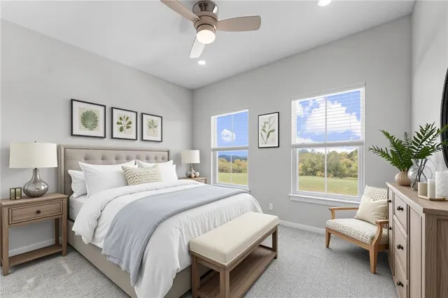 a spacious bedroom with a bed and a window