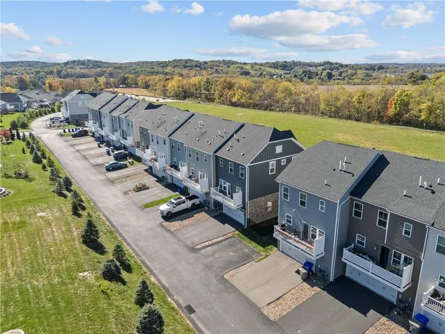 an aerial view of a house with a lake view