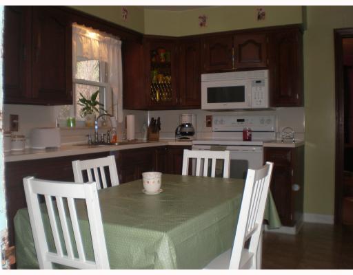 616 Greenlee Road Whitehall, PA 15227 - Photo 4 of 8 Kitchen. Cherry cabinets, white countertops and white appliances make this eat-In kitchen convenient for any family. Kitchen has door leading to screened porch & deck with attached seating. Porch has stairs leading to the beautiful fenced yard.