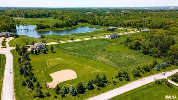 a view of a lake with a yard
